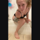 A blonde girl records herself shitting on the floor while sitting on the edge of a bathtub. Presented in 720P vertical HD format. Over 2 minutes.